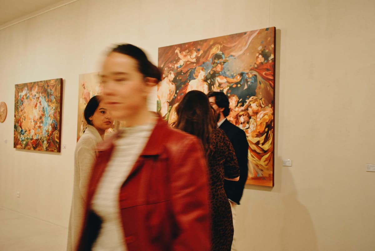a woman walking through a museum